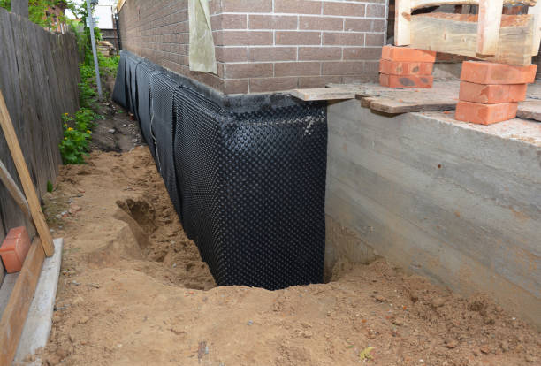 Happy homeowners after waterproofing job in Sunfield